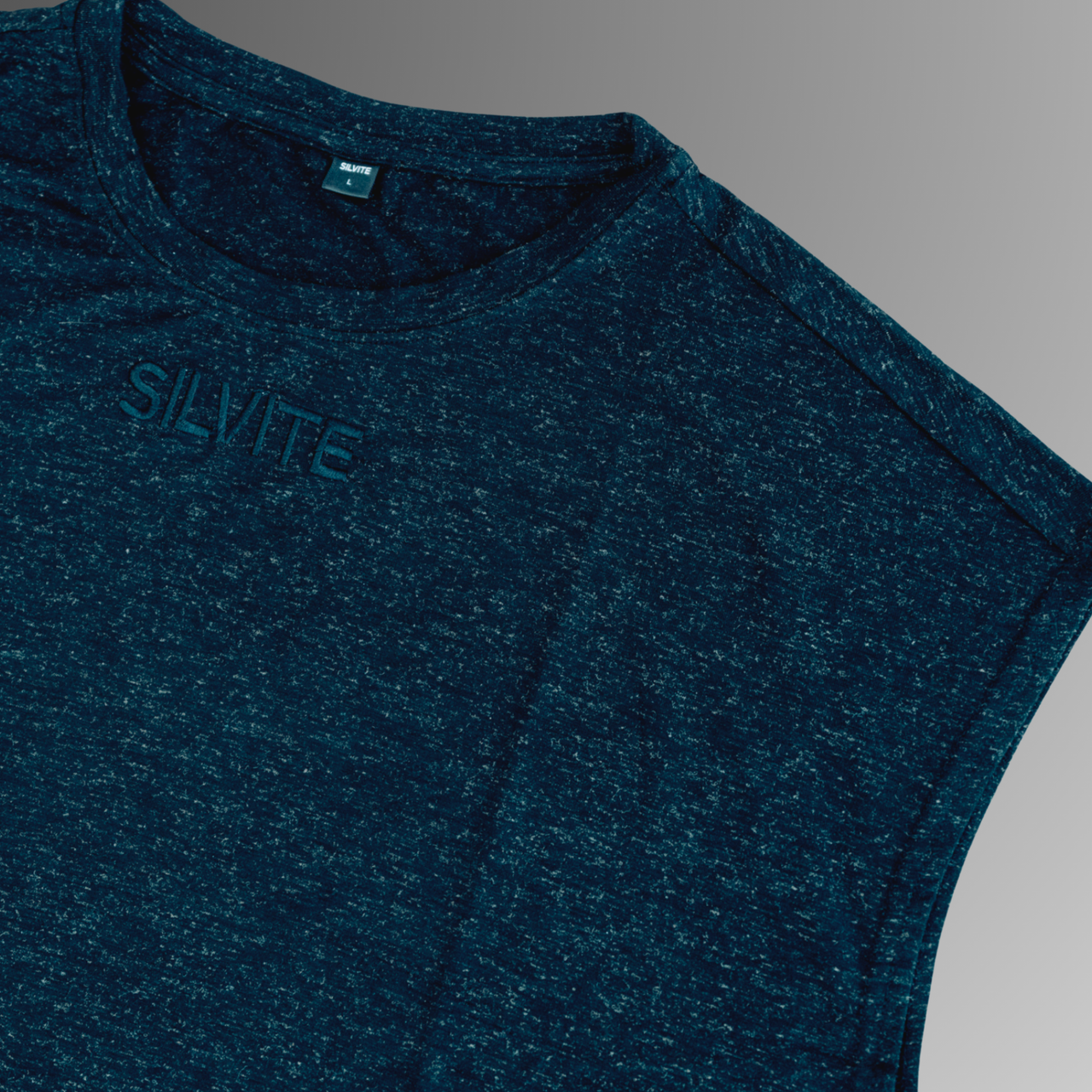 Close-up of a dark gray antibacterial sleeveless pyjama shirt with 'SILVITE' printed on the chest, set against a neutral gray background.