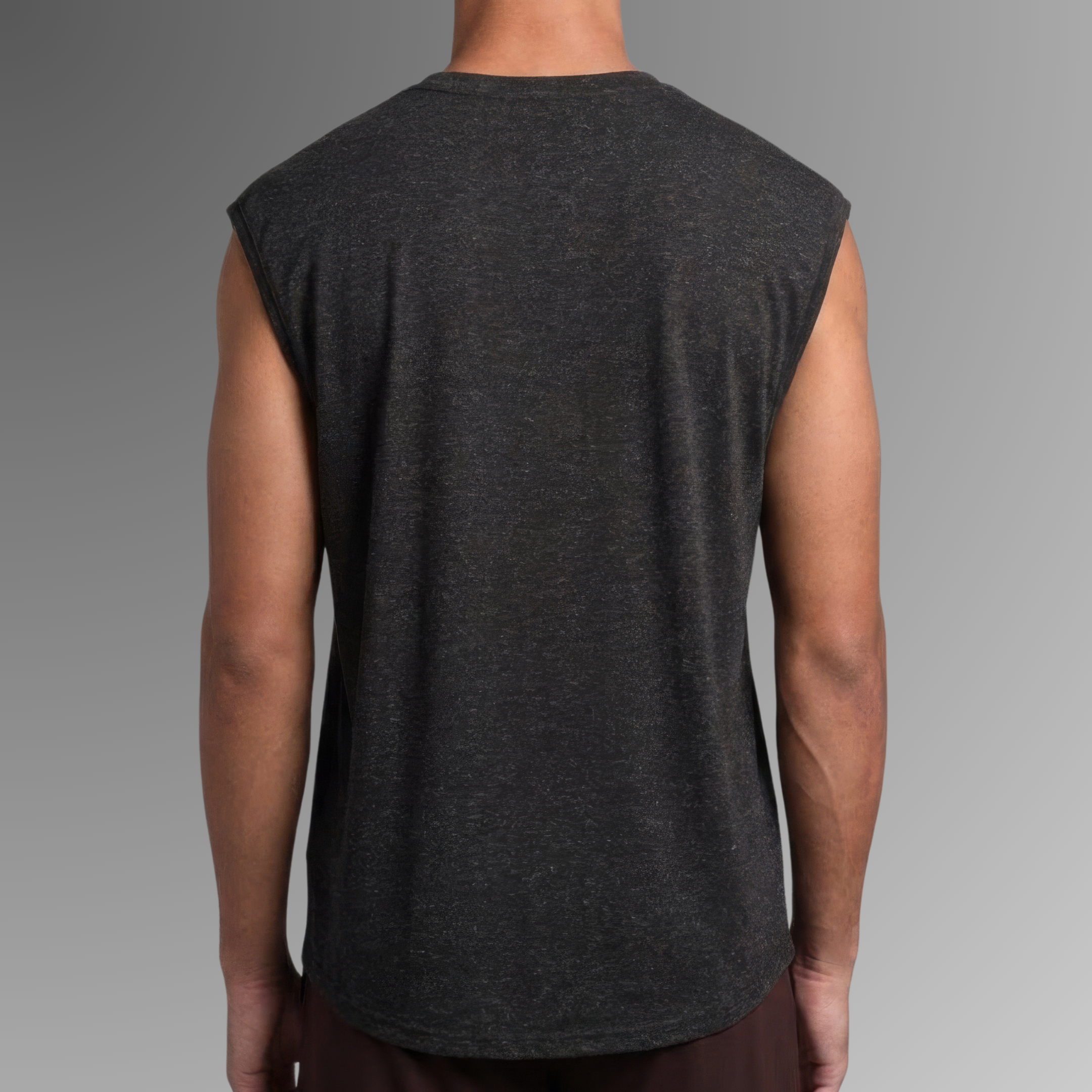A man viewed from the back wearing a dark charcoal gray sleeveless antibacterial pyjama t-shirt against a gradient gray background.